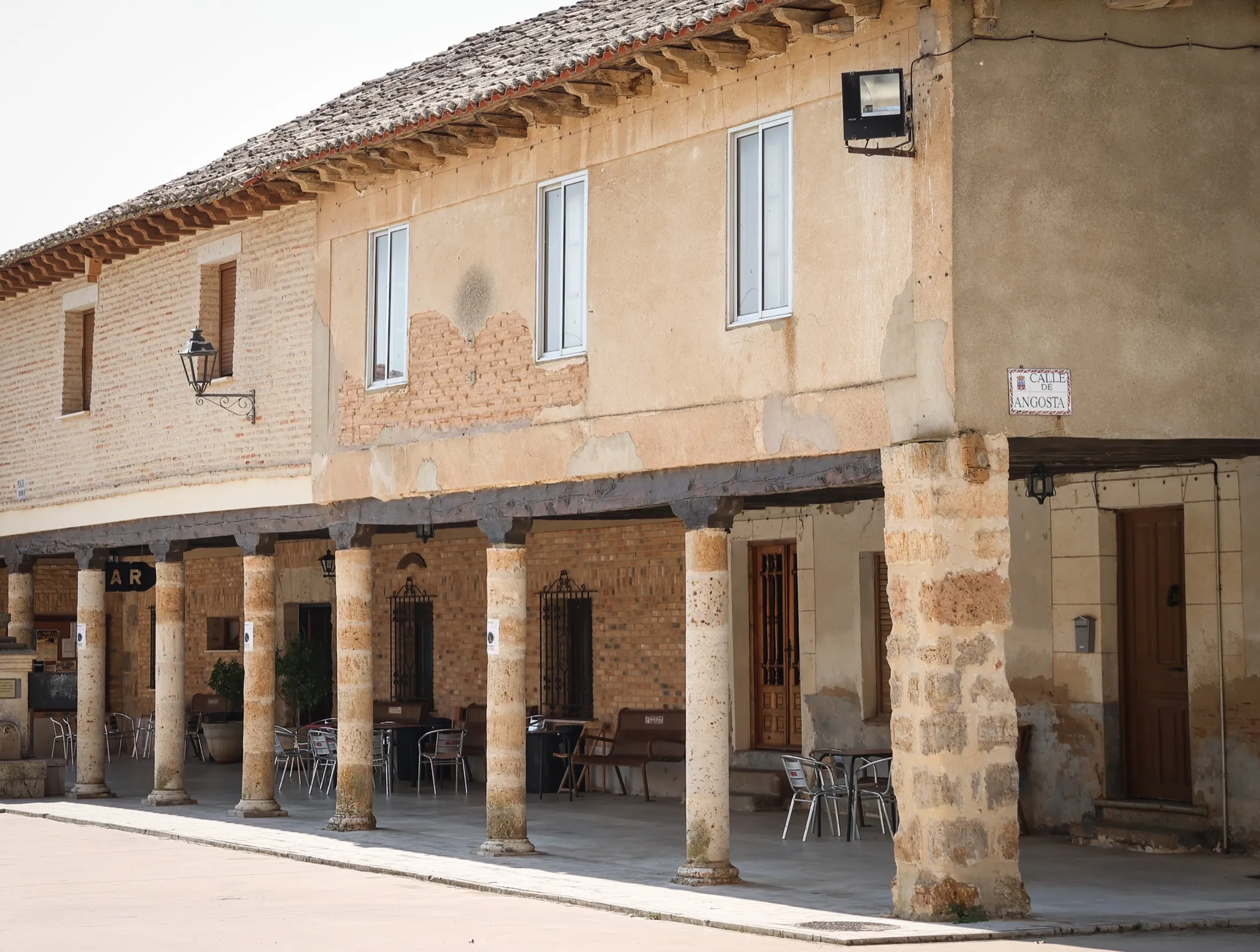 Stone arcade building in Padilla de Abajo