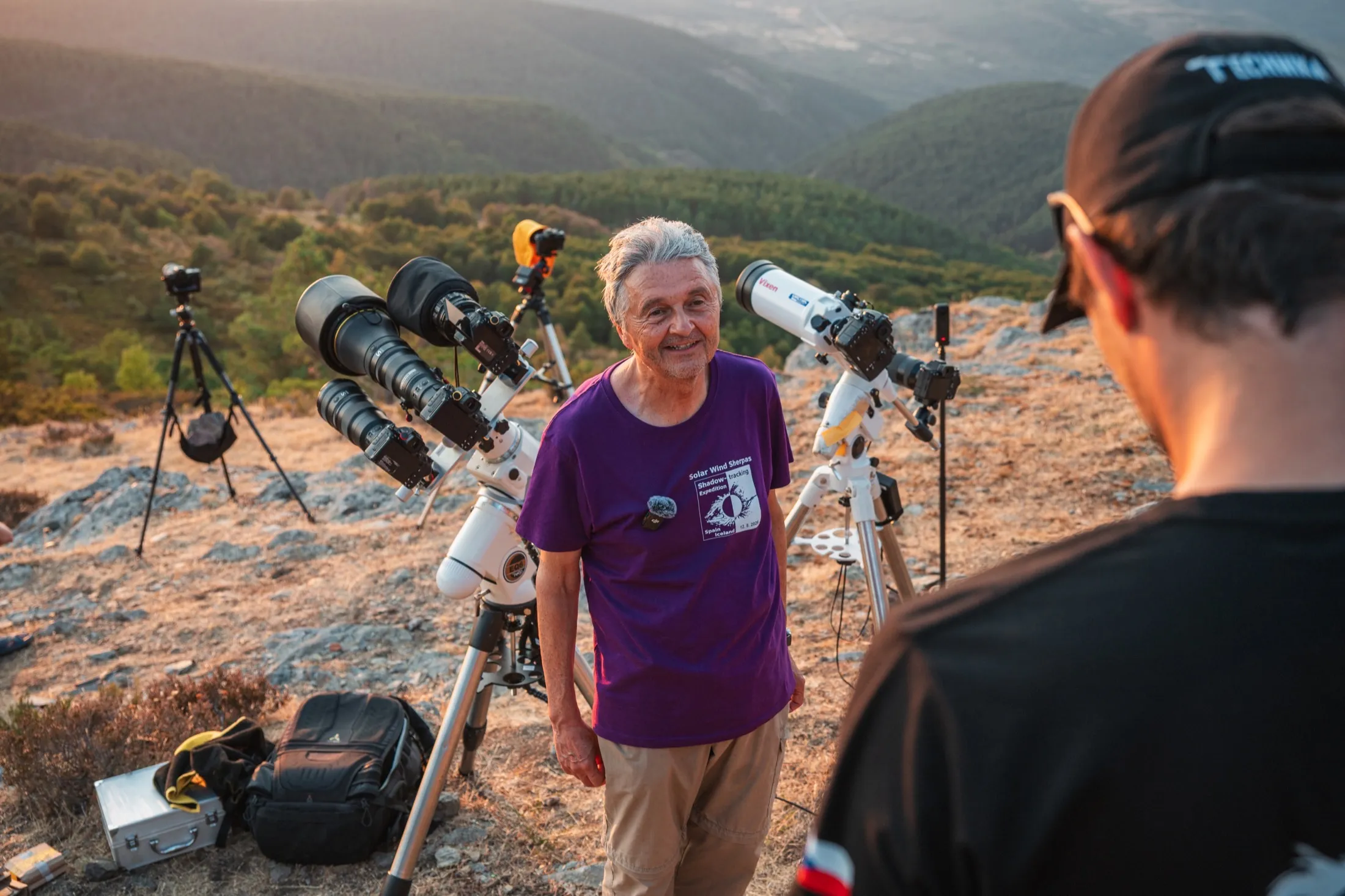 Team members talking beside the instruments on the ridge