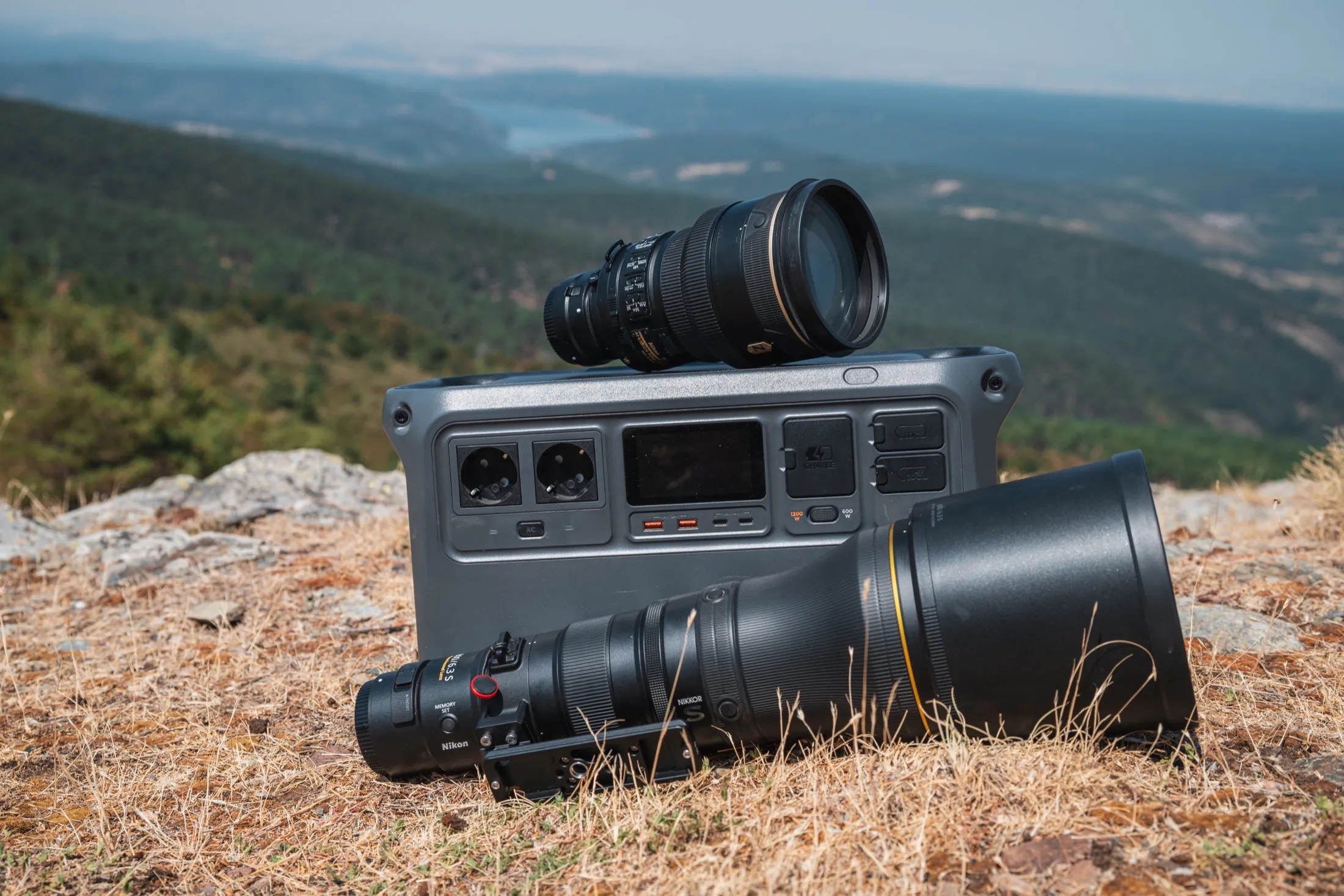 Large telephoto lenses and a field electronics case on the ground