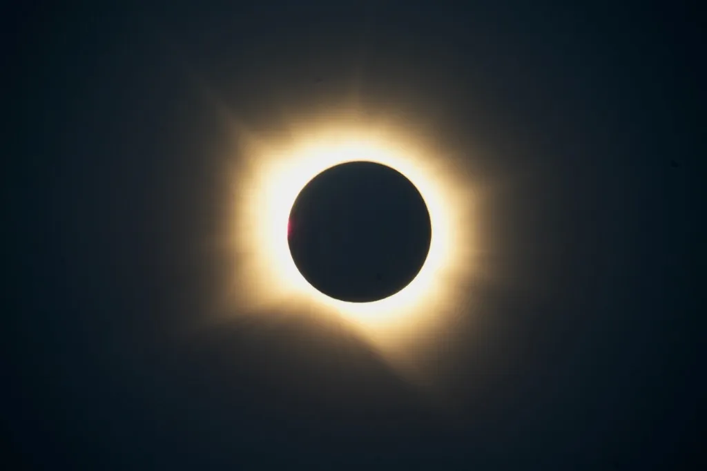 Total solar eclipse, with the Moon covering the Sun and the corona glowing around it