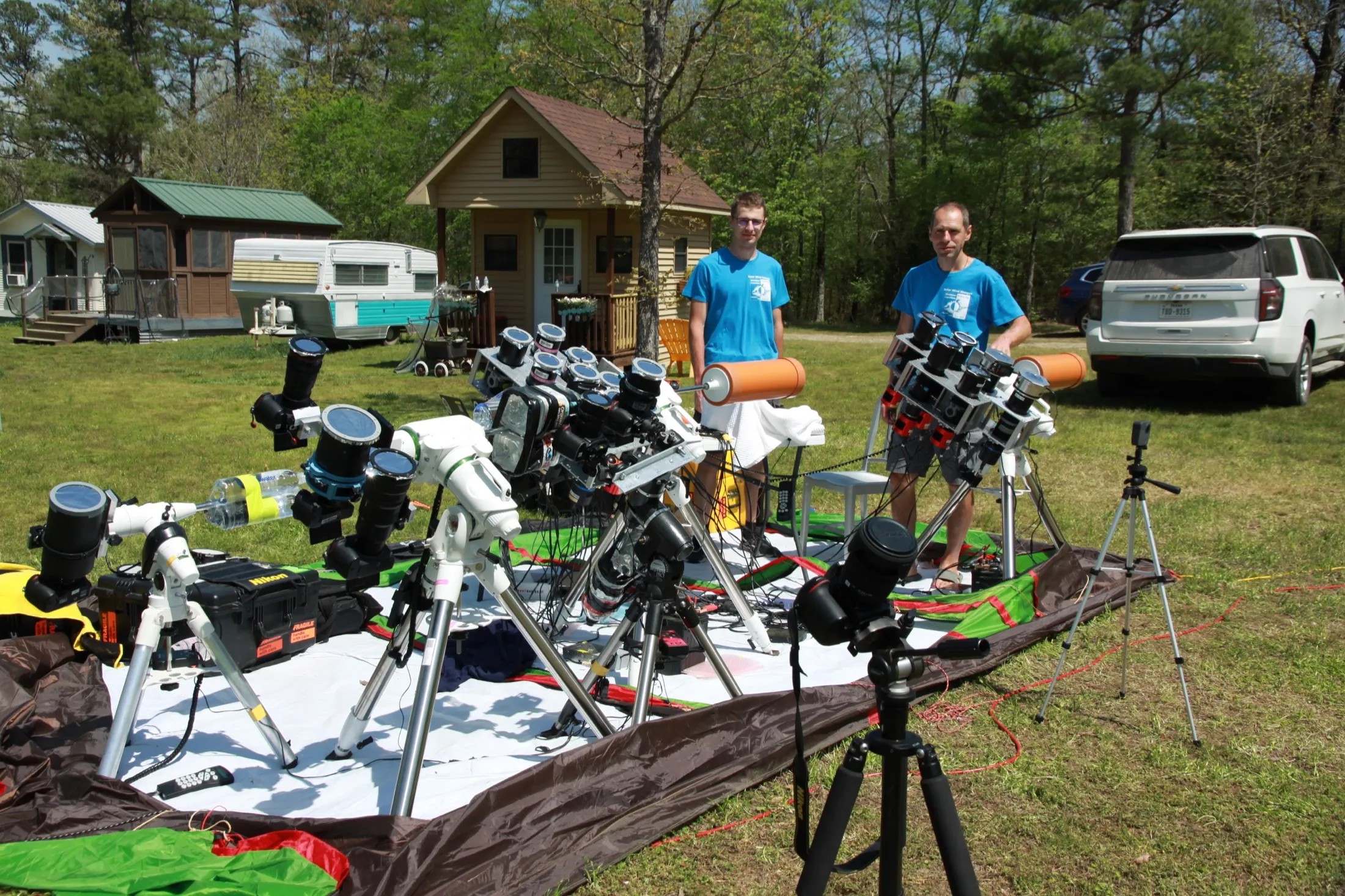 Petr and Matěj behind a dense array of cameras prepared for totality