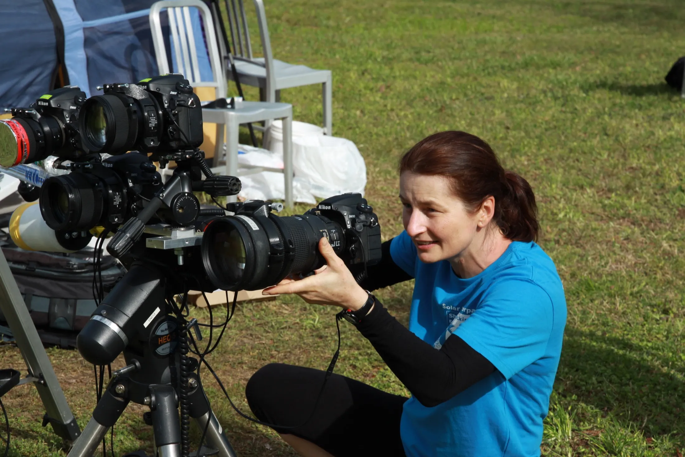 Jana adjusting a multi-camera rig in the field