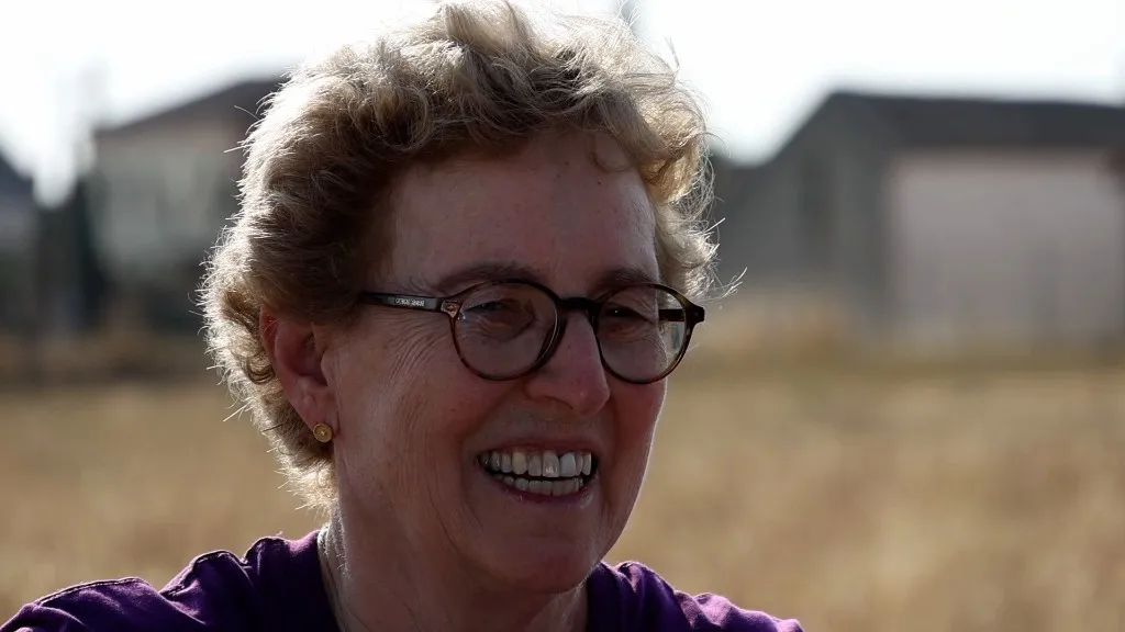 Dr. Shadia Habbal smiling in the field